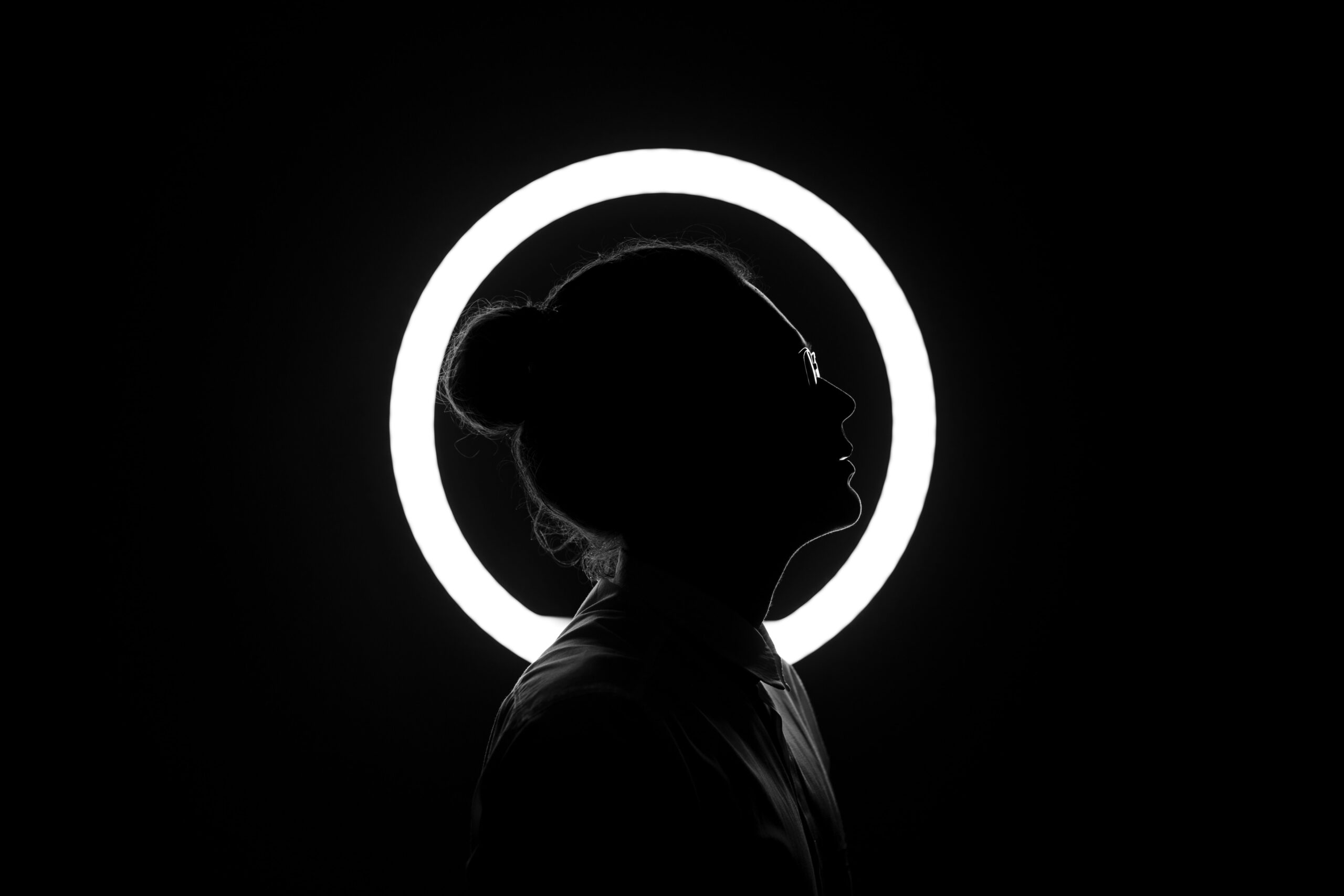 woman standing by halo light